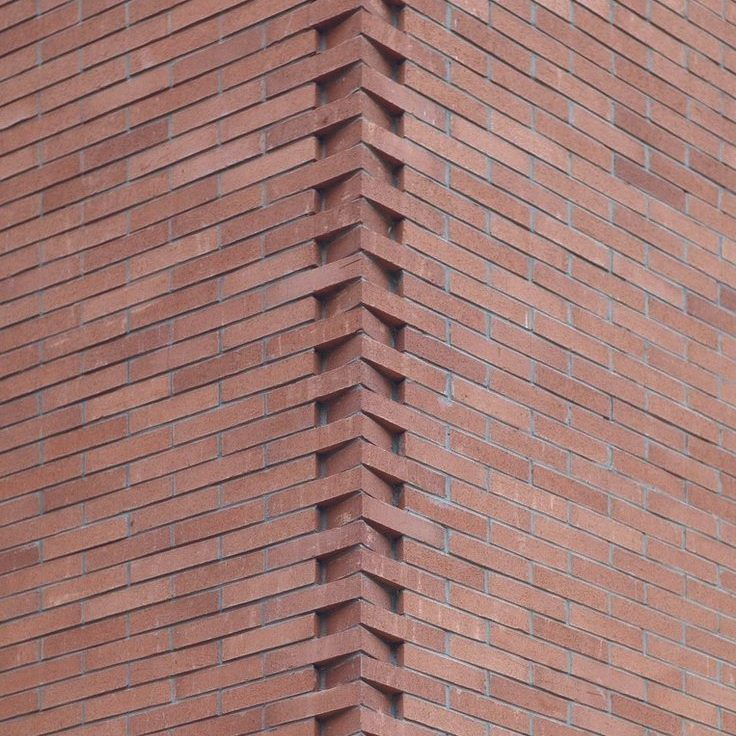A red brick corner with recessed coursing