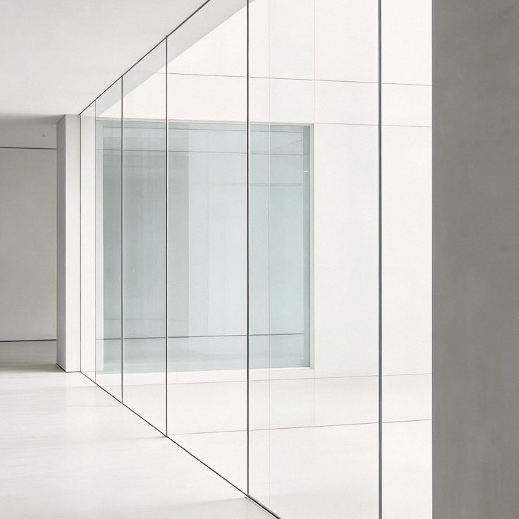 Full-height glazing filling a room with light